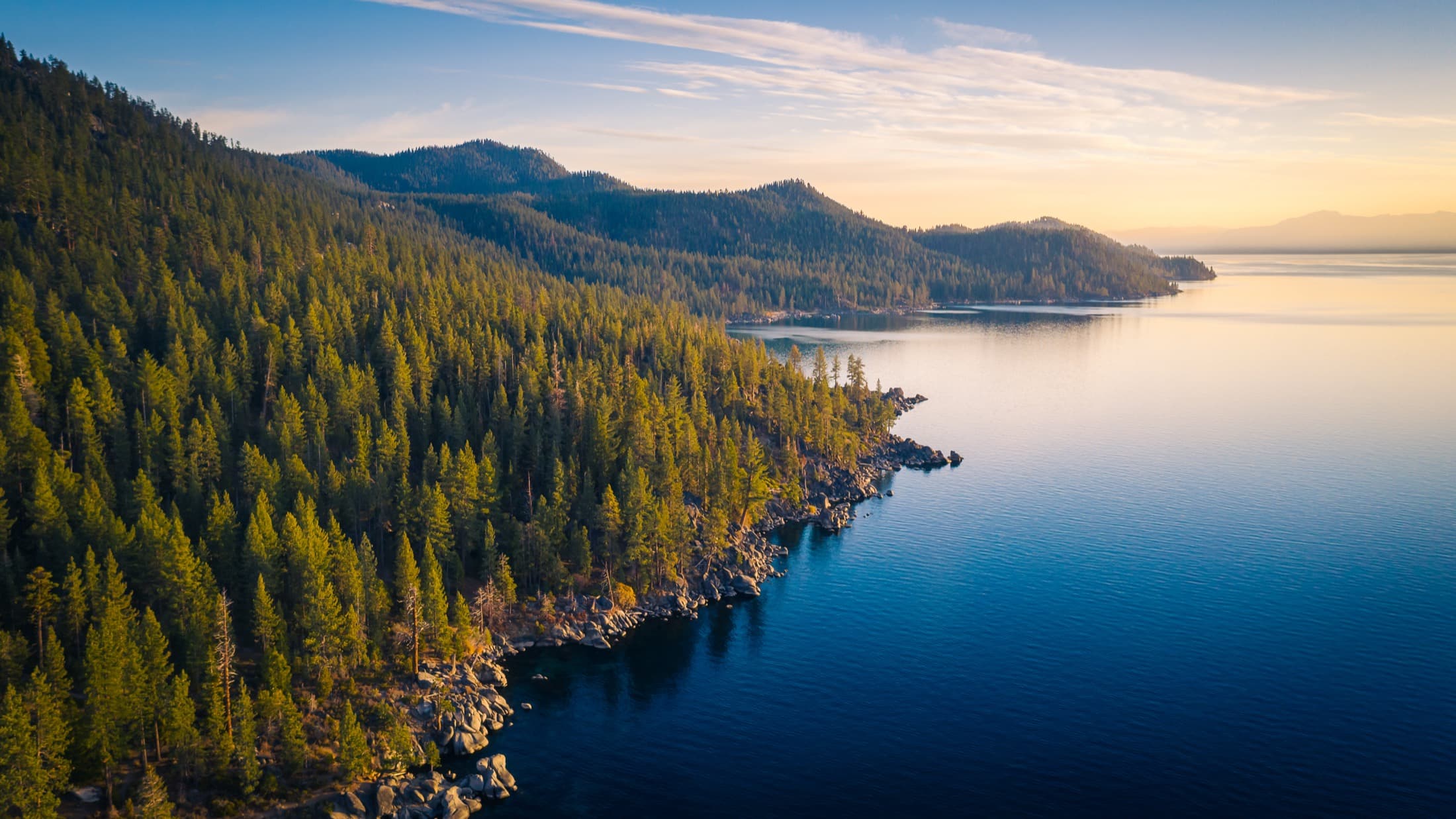 Golden-hour lake and evergreen forest in Washington State